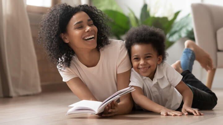 mother reading book to child